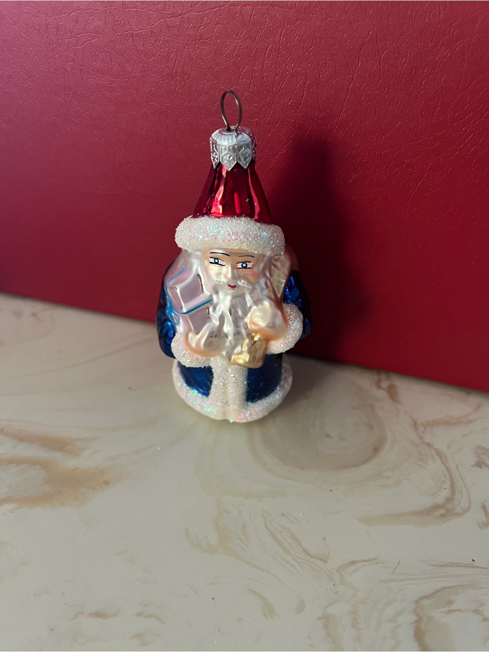 Christopher Radko Blue Coat Santa Ornament with Red Hat and White Glitter Trim